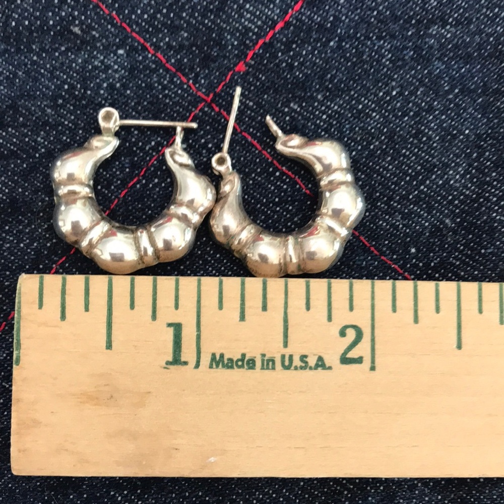Silver shrimp hoop earrings